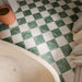 Divine Taj Mahal marble-effect chequerboard tiles, combining soft ivory tones with rich green marble-effect detailing. The classic chequerboard layout creates a timeless statement floor, bringing elegance, contrast and character to both traditional and contemporary interiors.