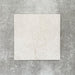 Close-up of Divine Taj Mahal matt marble-effect tile in a 30cm x 30cm format, featuring soft ivory and warm cream tones with subtle natural stone-inspired movement. The understated marble effect creates a timeless and elegant finish, making it ideal for chequerboard floor designs, bathrooms, hallways and sophisticated interior spaces.