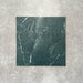 Close-up of Divine Verde Green matt marble-effect tile in a 30cm x 30cm format, featuring rich green tones with elegant white veining and natural marble-inspired movement. The bold stone effect creates a luxurious, timeless finish, making it ideal for statement chequerboard floors, feature areas and sophisticated interior schemes.