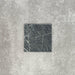 Close-up of Fayrouz Verde tumbled natural marble tiles in a 15.2cm x 15.2cm format, showcasing rich deep green tones, striking white veining and authentic stone variation with a beautifully aged tumbled finish.