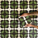 Abstrakter Illusion Verde Noir Musterfliese im Format 20 × 20 cm, in einem wiederholten Raster verlegt, um das markante Design mit optischer Illusion hervorzuheben. Tiefschwarze und sattgrüne, geschwungene Formen erzeugen ein ausdrucksstarkes, kontrastreiches geometrisches Muster, gezeigt während der Verlegung, um zu veranschaulichen, wie sich das Design über Bodenflächen oder Akzentwände hinweg ausrichtet und wiederholt.
