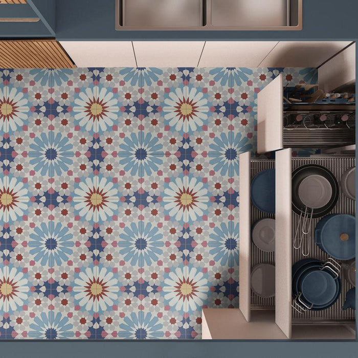 Kitchen floor featuring Fez Fiera Moroccan style porcelain tiles with a repeating geometric star pattern in blue, terracotta, grey and cream