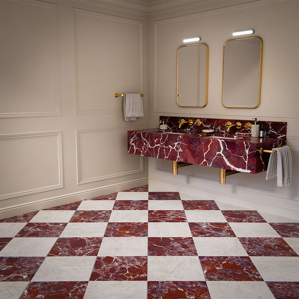 Bathroom interior featuring Divine Levant Rouge Matt Marble effect 30 × 30cm porcelain floor tiles in a chequerboard layout, styled with a floating vanity, brass fittings, and bold red tones with natural stone-inspired veining.