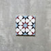 Agadir Atlas Mini Moroccan-style 15x15cm porcelain tile featuring a geometric star pattern in soft blue, burgundy, black and cream, shown as a single tile on a neutral background.