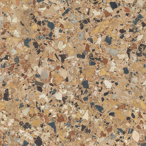 Close-up of the Stuzzi Amber 60x60cm terrazzo style porcelain tile, featuring a warm amber-toned base with a mix of large and small stone fragments in cream, ochre, rust, charcoal and soft grey, finished with a realistic 4D brushed surface texture.
