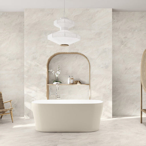 Bathroom interior featuring Taj Mahal Matt 60 × 120cm marble effect porcelain wall and floor tiles, showcasing soft cream tones with gentle, flowing veining. The larger format enhances the sense of space, creating a seamless, spa-like setting complemented by warm wood accents and soft, natural light.