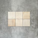 Zellige Beige Quadratfliesen, im schlichten Raster verlegt, mit glänzend weißem Finish, dezenter tonaler Variation und sanft unregelmäßigen Kanten.
