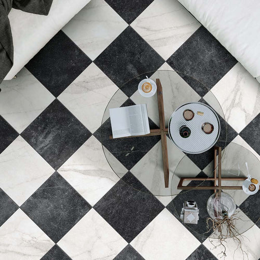 Living room featuring Vitoria Antique Black Marble Style Chequerboard 30 × 30cm porcelain floor tiles, laid in a classic chequerboard pattern and styled with glass coffee tables, neutral furnishings, and contemporary décor.